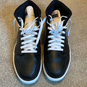 Black leather and satin Air Jordan ones